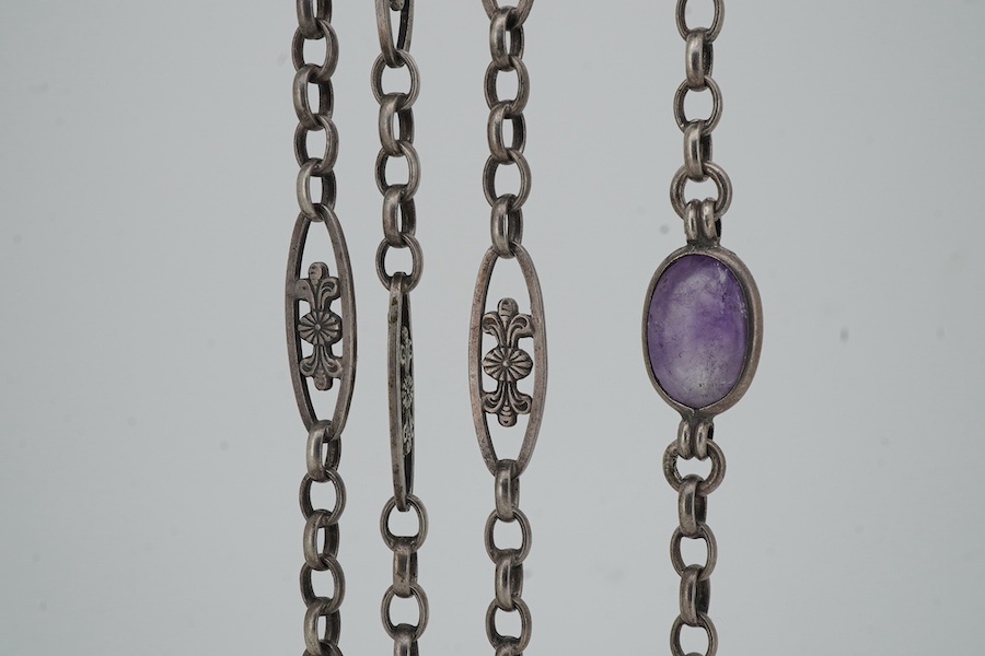 A late 19th/early 20th century silver and amethyst longchain, composed of foliate links and set with cabochon amethysts, length 150cm, stamped 800, maker's mark HY